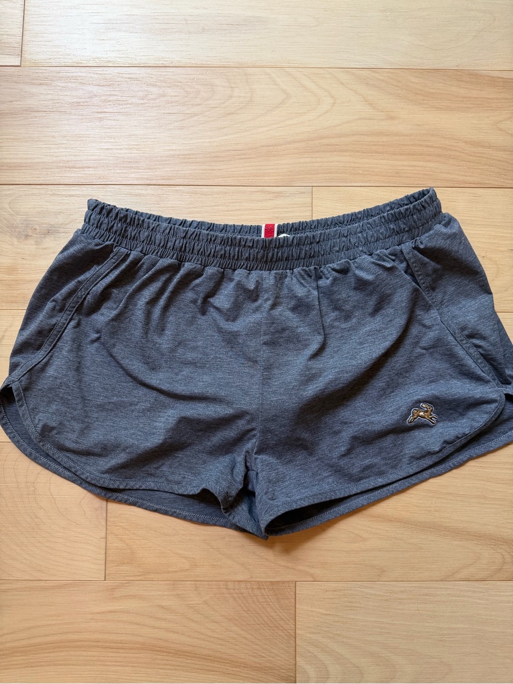 Tracksmith Charcoal Grey Athletic Shorts with Gold Rabbit Emblem